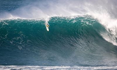 Eddie Aikau surf contest: local lifeguard beats world’s best big wave surfers to take title