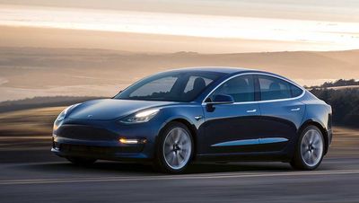 Tesla Stock Surges On Earnings, Upcoming Vehicles; Analysts Hike Price Targets