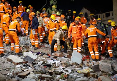 Twelve rescued after building collapses in India; more feared trapped