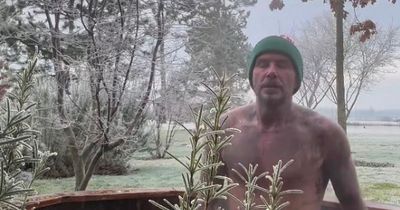 David Beckham strips off to underwear and bobble hat for ice bath dip