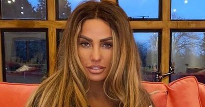 Katie Price proudly poses with her old socks before sending worn items to fans