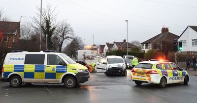 Police close road after school bus and van crash