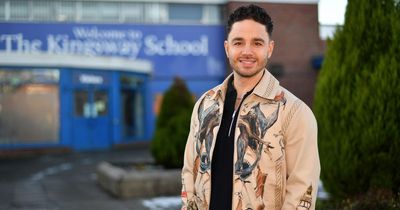 Waterloo Road star Adam Thomas goes back to school to inspire new generation after making TV debut alongside Hollywood star