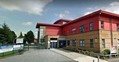 Girl of 14 stabbed at a school in south Manchester was attacked with a broken bottle