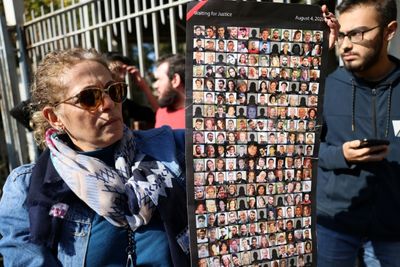 Beirut blast victims' relatives rally for embattled probe judge