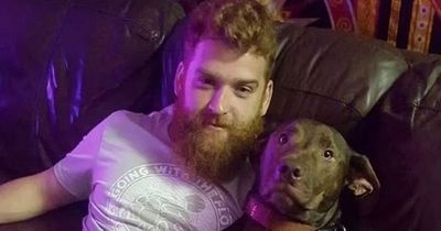 Man shot dead by his own DOG lounges on sofa with beloved pet who later killed him