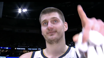 Nikola Jokic was comically sidetracked during an interview because he saw two fans kissing