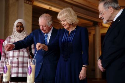 King and Queen Consort light candles to remember horrors of the Holocaust