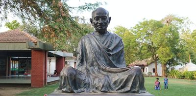 Gandhi's image is under scrutiny 75 years after his assassination – but his protest principles are being revived