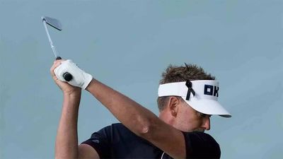 Rain disrupts play as Poulter and Bland lead