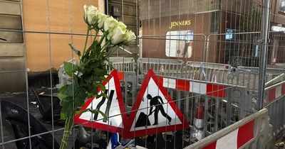 Edinburgh residents lay floral tributes to firefighter outside of Jenners building