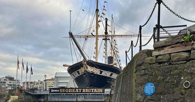 Extinction Rebellion fix 'blue plaques' to Bristol landmarks in sewage protest