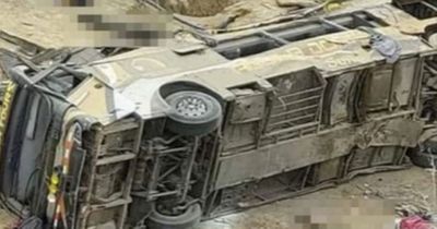 Tour bus carrying over 60 people plunges off 'curve of death' cliff killing at least 23