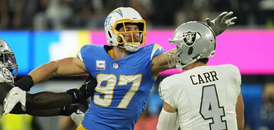 Joey Bosa happily posed for pictures while wearing 49ers gear before his brother’s NFC title game