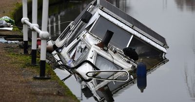 Mystery as unoccupied houseboat stuffed with Carling lager sinks in Salford canal