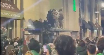 Philadelphia Eagles fans fall through bus stop in wild NFC Championship celebrations