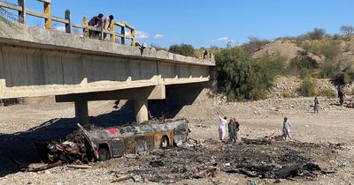 Bus full of passengers plunges off Pakistan bridge and bursts into flames killing 40
