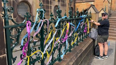 Ribbons tied by abuse survivors removed from Sydney's St Mary's Cathedral