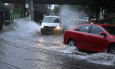 Flash flooding traps Sydney drivers in their cars after torrential rain hits city