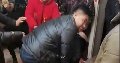 Brutal wedding 'hazing' sees bride pinned down and sprayed with foam by gang of men