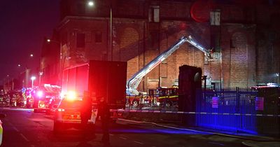 Smoke billows from windows as abandoned building burns again