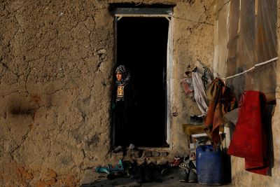 Parents grieve for three-month old baby, a victim of Afghanistan's deadly winter