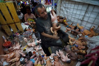 Broken baby Jesus statues flood restorers ahead of feast day