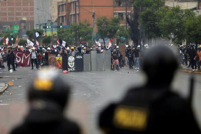 Protesters stand ground as Peru congress mulls early elections