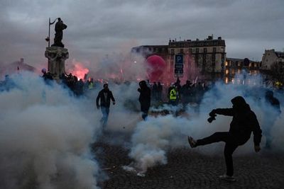 Riot police clash with protesters in Paris as 1.2million take to streets of France against pension reforms