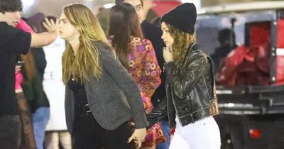 Cara Delevingne holds hands with girlfriend Minke at Harry Styles concert in California