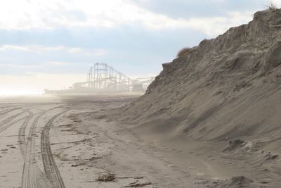 Judge: Defiant NJ beach town can sue for $21M in dune costs