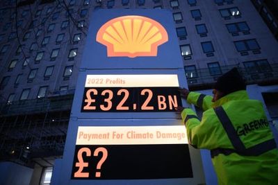 Greenpeace protests outside Shell HQ in London after record profit announced