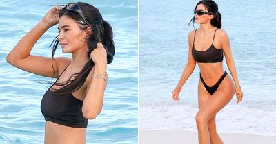 Kylie Jenner shows off shrinking curves in thong bikini on solo beach trip after breakup