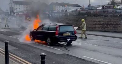 Car blaze sees police seal off major road