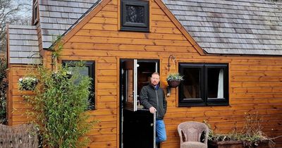 Man saves £600 a month by living in a wooden house in his friend's garden