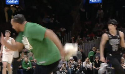 A Celtics ball boy comically zoomed off the court after getting caught in the game, and NBA fans loved it