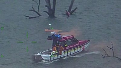Eight people rescued after boat capsizes in Lake Eildon in regional Victoria