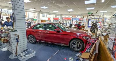 Mercedes ploughs through crowded charity shop window injuring three people in 'shocking' accident