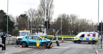 Main road closed after car 'demolishes' traffic light near roundabout