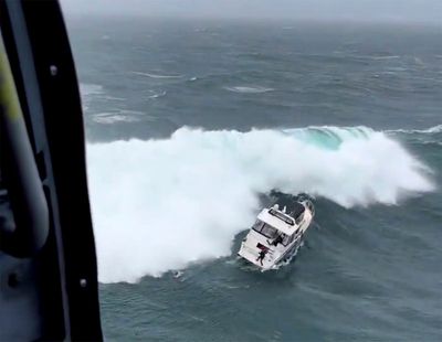 Coast Guard makes dramatic rescue as wave rolls yacht