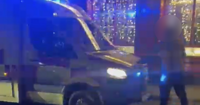 Woman left shaken after allegedly being 'thrown against taxi' after filming men who blocked ambulance in city centre