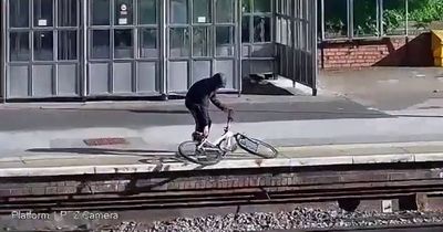 Watch yobs hurl bike onto train tracks - risking rail derailment and prompting warning