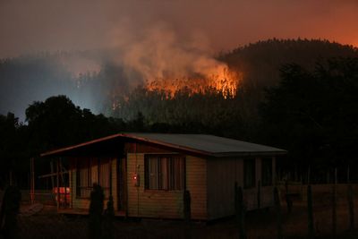 At least 24 dead in Chile as wildfires spread, driving many to flee for safety