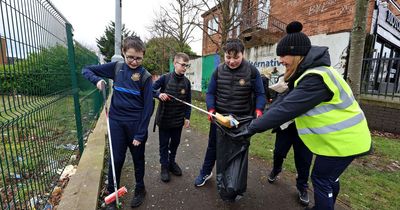 Belfast Model's young men take to the streets of their community in fundraising clean-up
