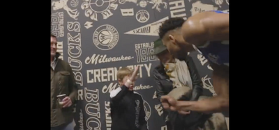 Giannis Antetokounmpo gave a young fan his shoes after losing Rock Paper Scissors and fans loved it