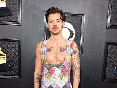 Harry Styles sparks comparisons to The Rainbow Fish in colourful jumpsuit at 2023 Grammys