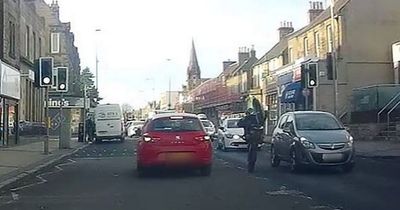 Alarming moment Edinburgh biker 'pulls wheelie' in heavy traffic on busy road