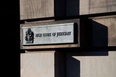 Police officer raped woman then pushed her downstairs, court hears