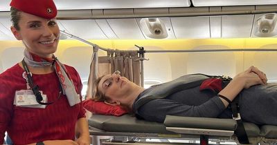 World's tallest woman forced to lie over 6 plane seats because she can't sit up