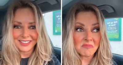 Carol Vorderman says she is 'world's happiest scruff' as she does makeup in service station loo